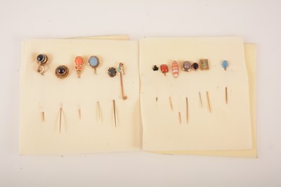 Lot 373 - Twelve stick pins and a bar brooch.