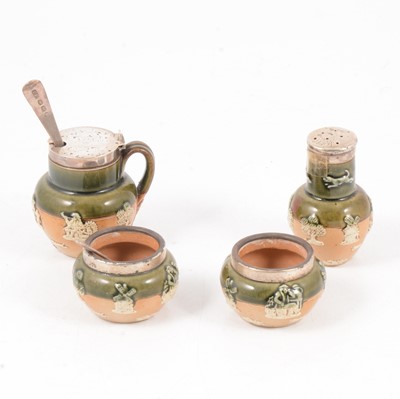 Lot 74 - Doulton Lambeth, a four-piece silver mounted cruet set
