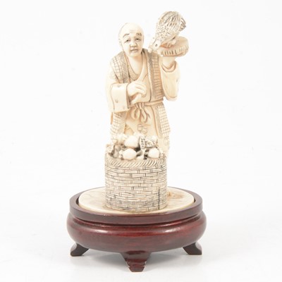 Lot 85 - Japanese carved ivory okimono of a street vendor