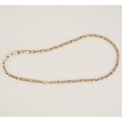 Lot 275 - A modern 9 carat yellow and white gold necklace.