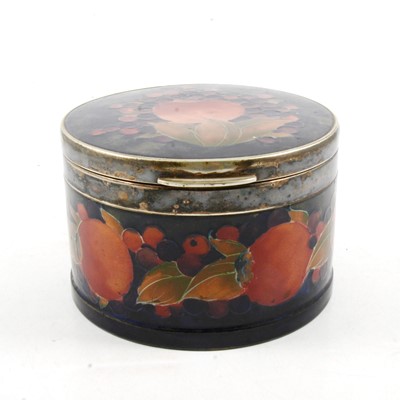 Lot 7 - William Moorcroft 'Pomegranate' pattern drum shaped box, circa 1920