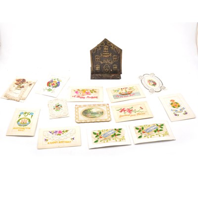 Lot 13 - Old metal money bank, designed as a bank facade, silk postcards