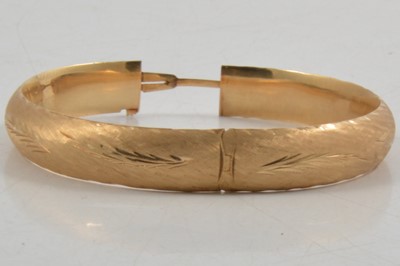 Lot 282 - A yellow metal bangle marked 14K.