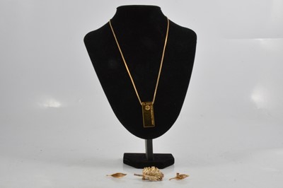 Lot 297 - A gold-plated ingot and chain, Flora Danica gold-plated leaf brooch, pair of leaf design earrings.