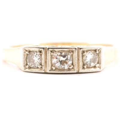 Lot 9 - A diamond three stone ring.