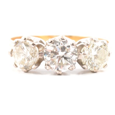Lot 8 - A diamond three stone ring.