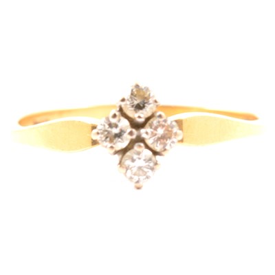 Lot 12 - A diamond four stone ring.
