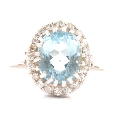 Lot 44 - An aquamarine and diamond cluster ring.