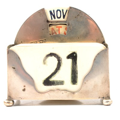 Lot 136 - Silver framed desk calendar