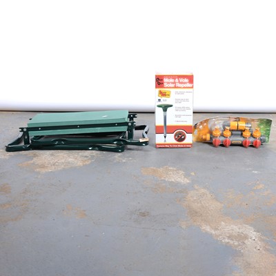 Lot 247 - A box containing hose pipe, garden gloves, etc.