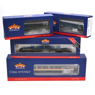 Lot 599 - Four Bachmann OO gauge model railway rolling stock and trucks.