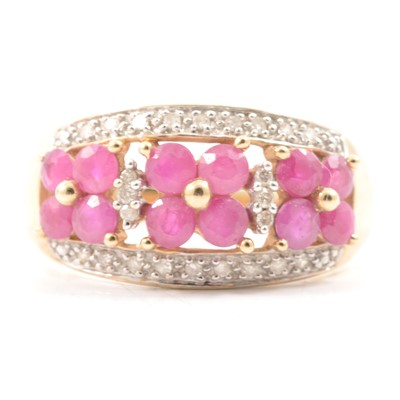 Lot 27 - A ruby and diamond domed ring..