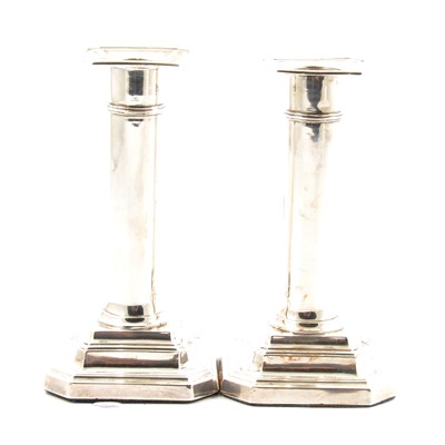 Lot 141 - A pair of silver candlesticks by James Dixon & Sons Ltd, Sheffield 1909.