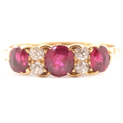 Lot 28 - A Victorian ruby and diamond half hoop ring.