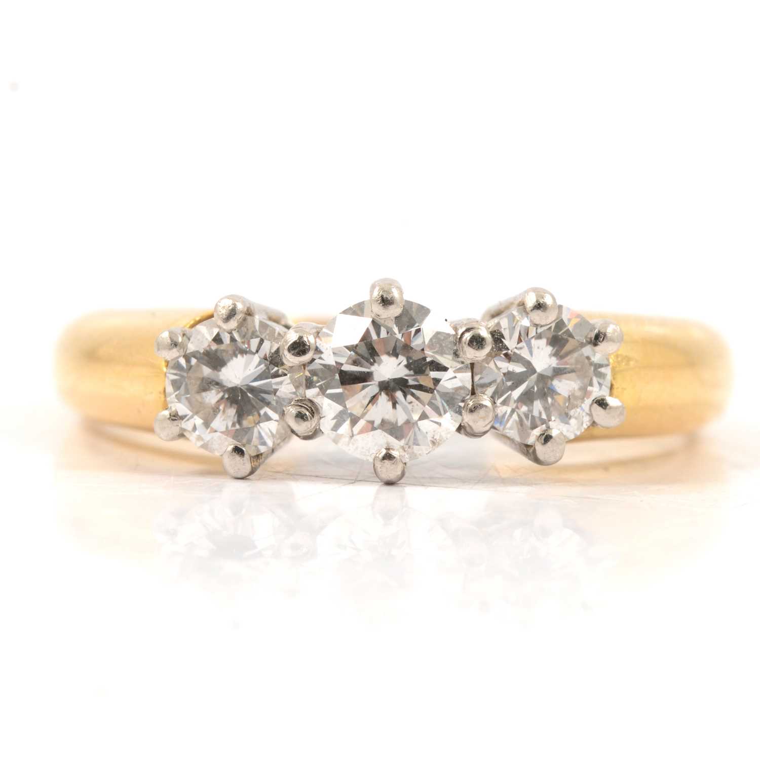 Lot 13 - A diamond three stone ring.