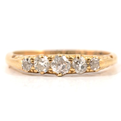 Lot 16 - A diamond five stone ring.