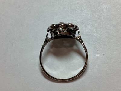 Lot 18 - A nine stone diamond cluster ring.