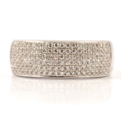 Lot 24 - A  modern diamond half hoop ring in 18 carat white gold, new and boxed.