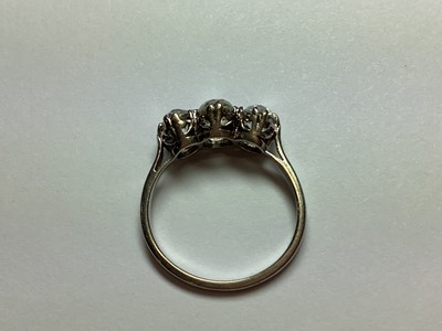 Lot 1 - A diamond three stone ring.