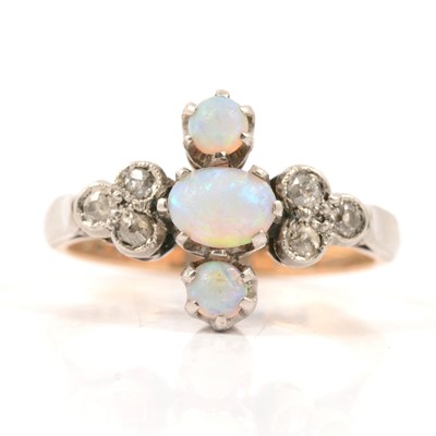 Lot 70 - An opal and diamond ring.