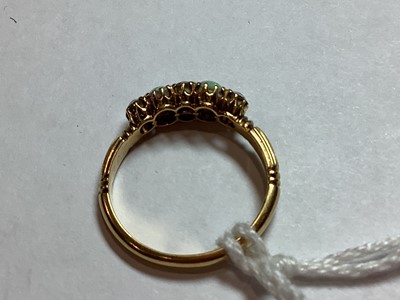 Lot 51 - An opal and diamond half hoop ring.