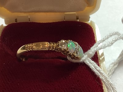 Lot 51 - An opal and diamond half hoop ring.