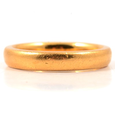 Lot 77 - A 22 carat yellow gold wedding band.
