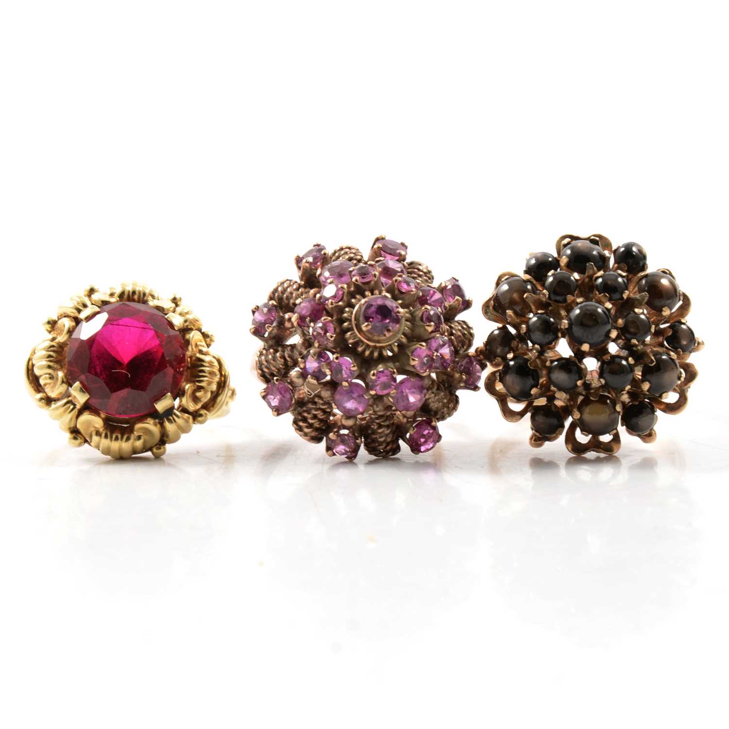 Lot 65 - Three gemset rings.