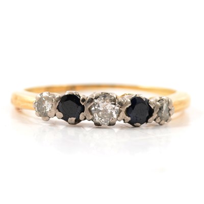 Lot 38 - A sapphire and diamond half hoop ring.