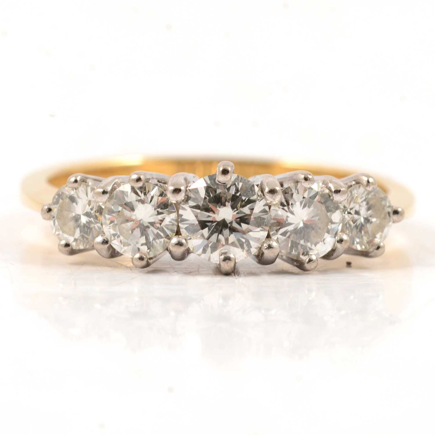 Lot 13 - A diamond five stone ring.