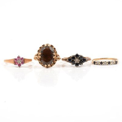 Lot 62 - Four gold gemset rings.