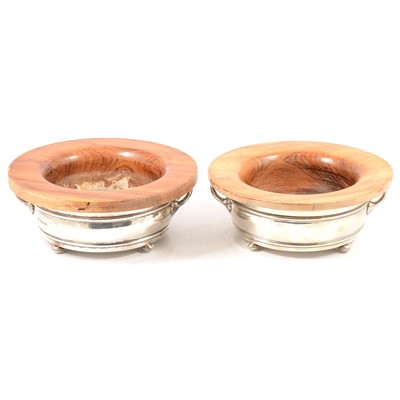 Lot 78 - Pair of silver framed bottle coasters, Goldsmiths & Silversmiths Company, London 1932