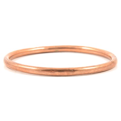 Lot 163 - A 9 carat rose gold slave bangle