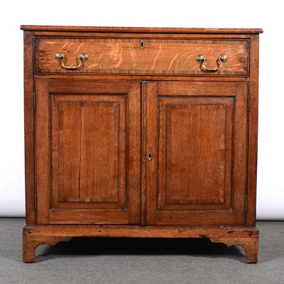 Lot 210 - George III oak cupboard