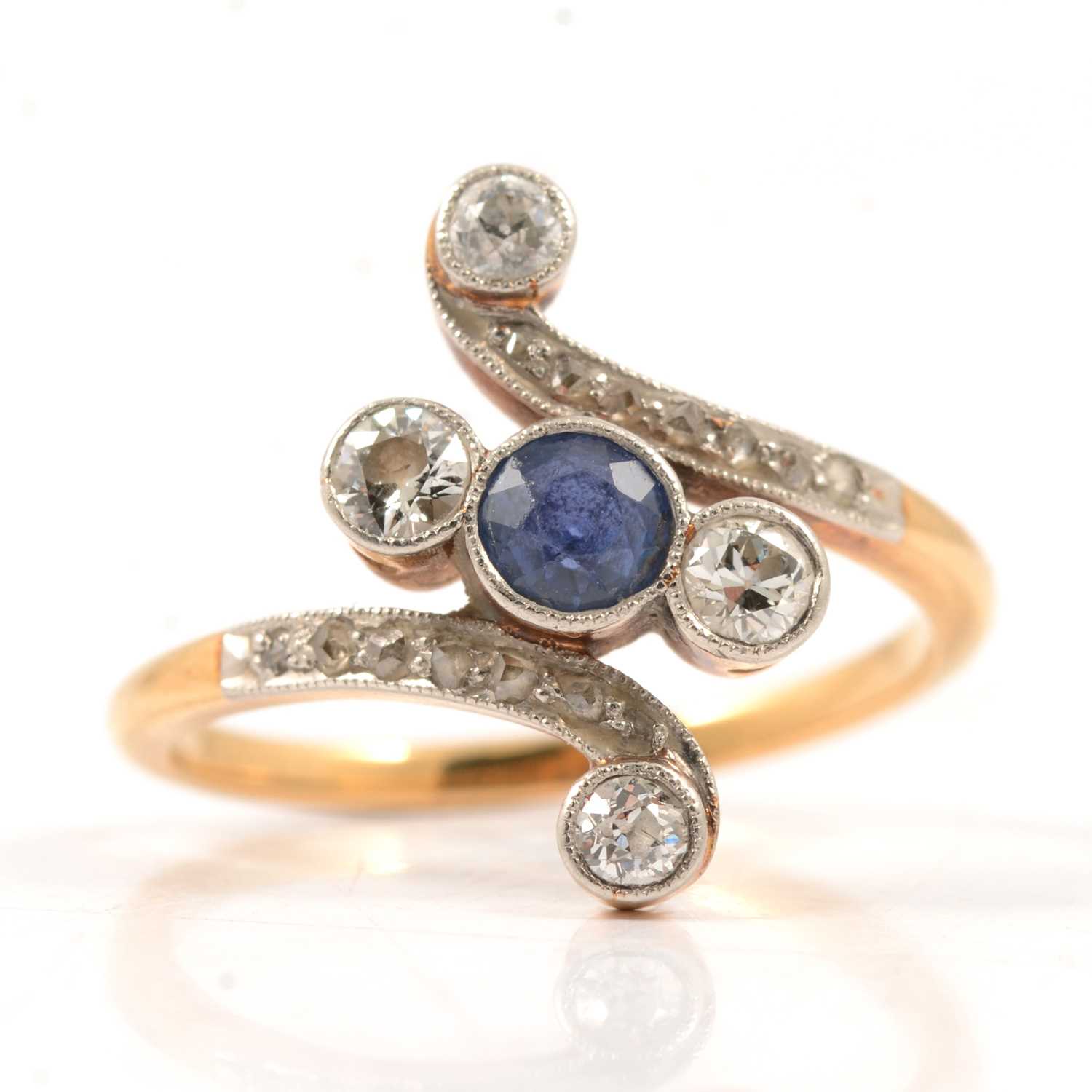 Lot 34 - A diamond crossover ring.