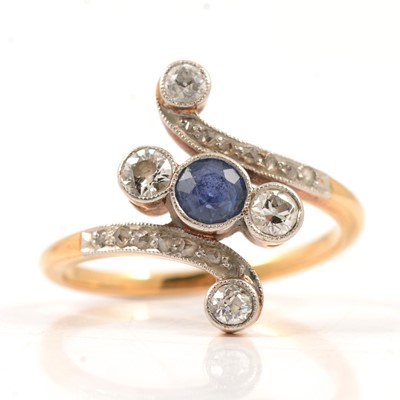 Lot 34 - A diamond crossover ring.