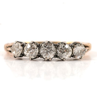 Lot 14 - A diamond five stone half hoop ring.