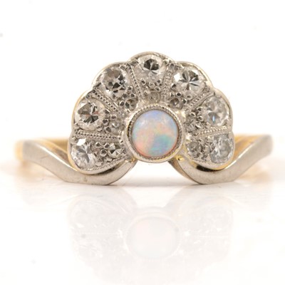 Lot 48 - An opal and diamond fan shaped ring.