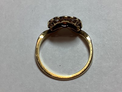 Lot 48 - An opal and diamond fan shaped ring.