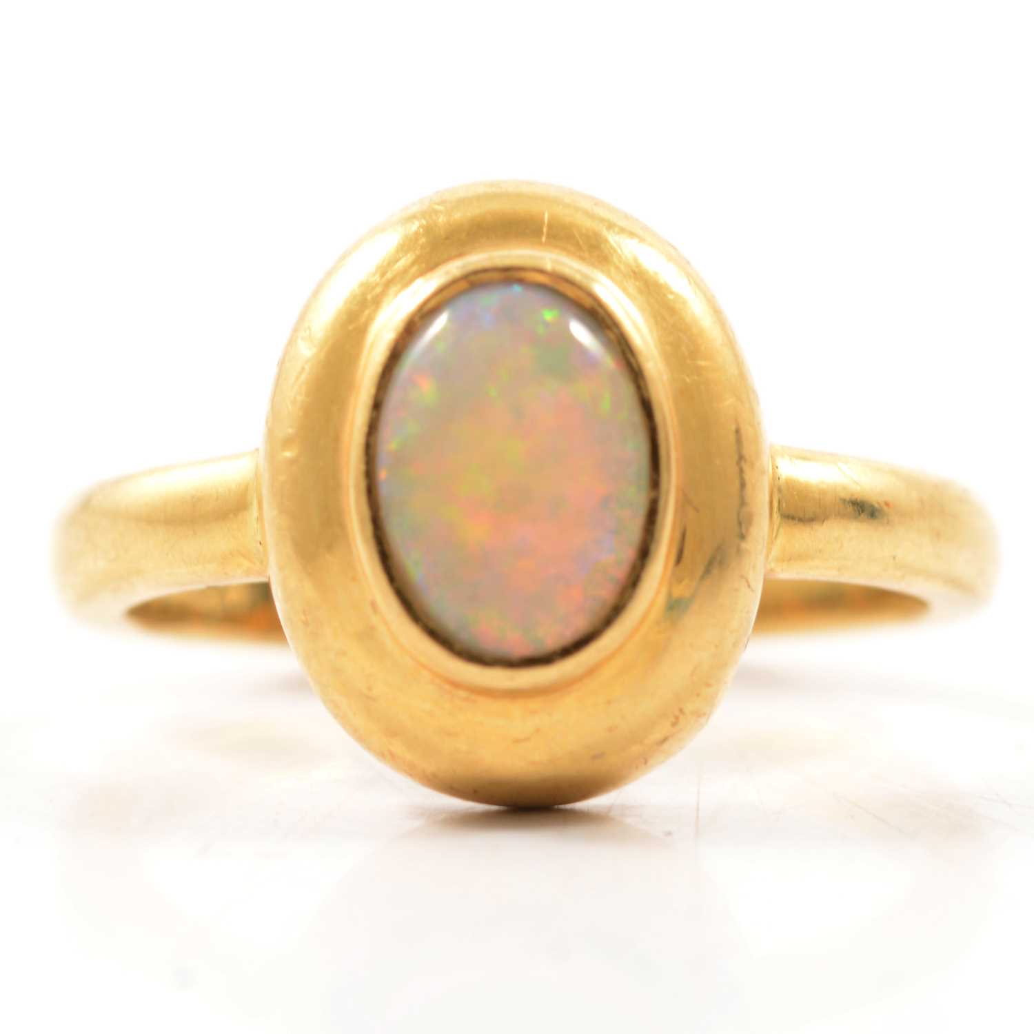 Lot 52 - An opal dress ring.