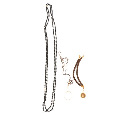 Lot 190 - Black glass beads, two woven hair pierces with locket and monocle.