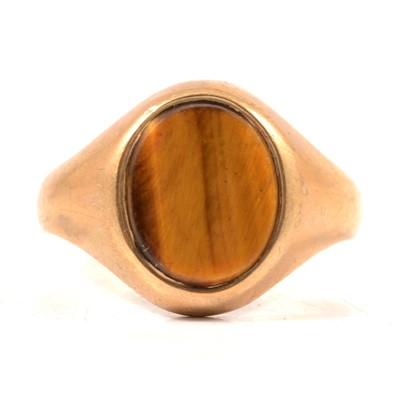 Lot 94 - A 9 carat yellow gold tigers eye signet ring.