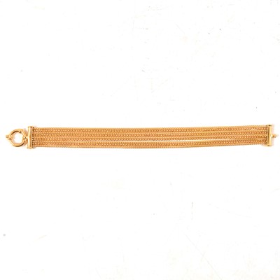 Lot 167 - A 9 carat yellow gold nine strand bracelet.