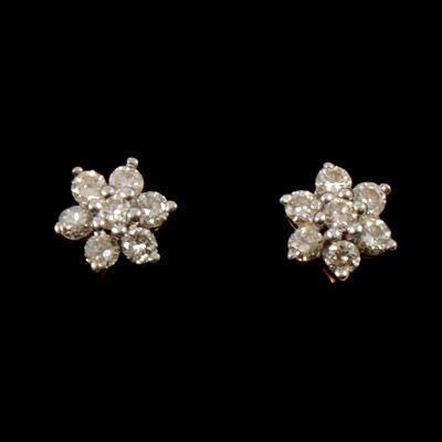 Lot 137 - A pair of small diamond cluster earrings.