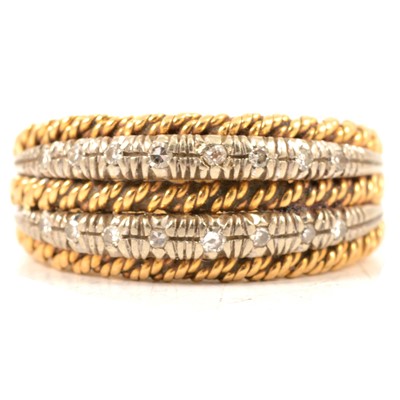Lot 25 - An 18 carat gold dress ring set with diamonds.