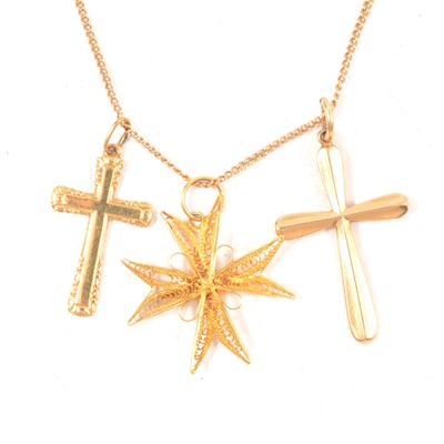 Lot 220 - Three gold cross pendants and a chain.