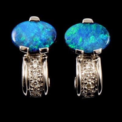 Lot 142 - A pair of opal and diamond earrings.