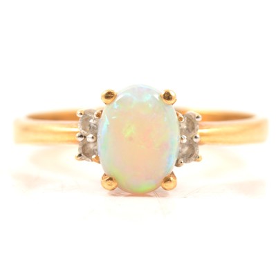 Lot 71 - An opal and diamond dress ring.