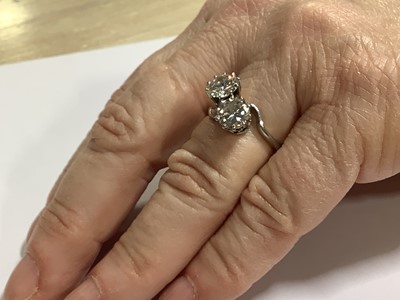 Lot 11 - A diamond two stone crossover ring.