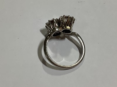 Lot 11 - A diamond two stone crossover ring.